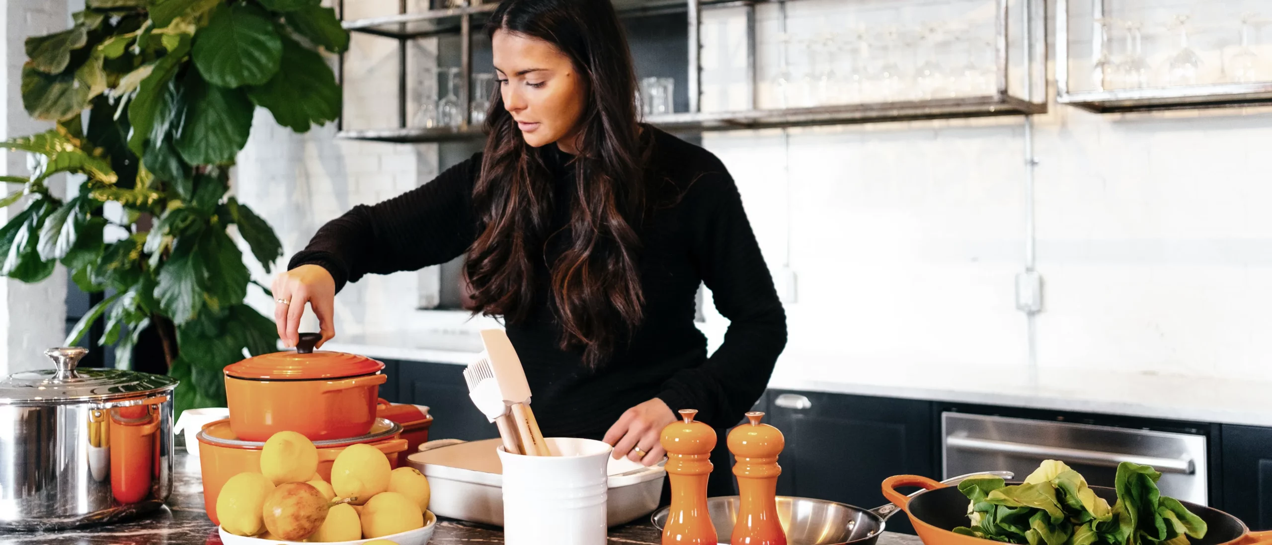 A young woman using food as medicine in her kitchen